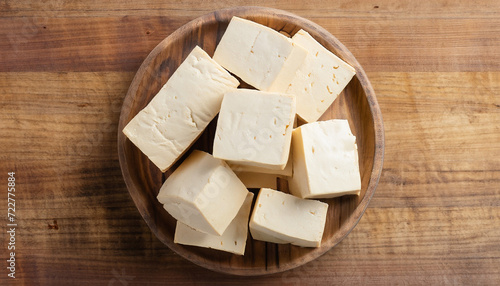 cube tofu on wooden board background with copy space, top view