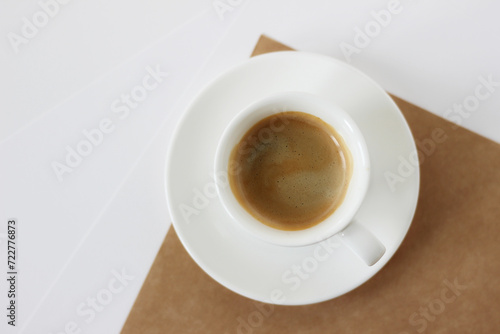 Cup of Coffee on Office Desk with Sheets of Paper. Coffee Break Refreshment.