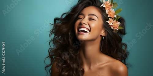 Beautiful Woman with Exotic Skin and Curly Hair on Blue Background with Copy Space. Portrait of a Woman Face for Beauty and Fashion Product Advertisements