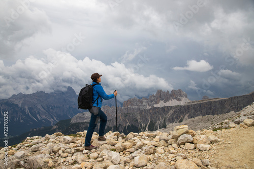 Woman traveler traveling alone in breathtaking landscape of Dolomites Mounatains. Travel lifestyle wanderlust adventure concept. © erika8213