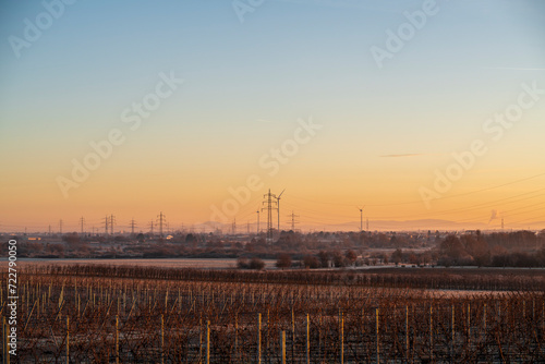 power lines in a rural landscape in the morning