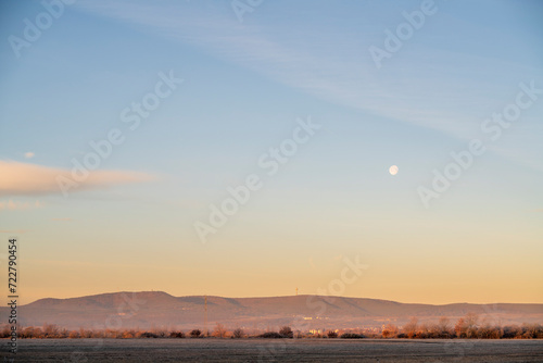 morning light over the hills with moon