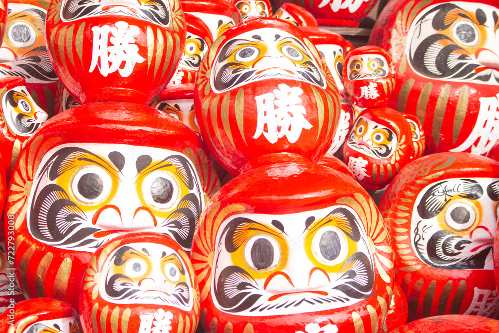 Many red daruma dolls or dharma dolls in Katsuo-ji temple. The Kanji translated to English : 'Victory'.