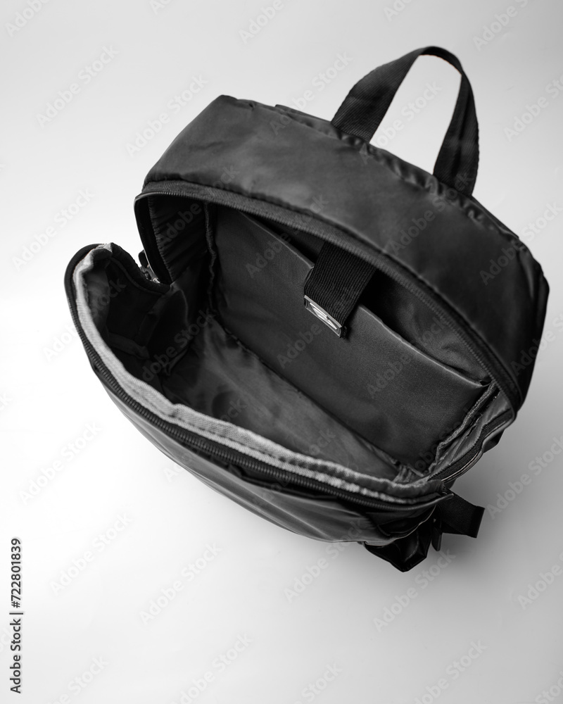 Fototapeta premium view inside an open black backpack on a white background