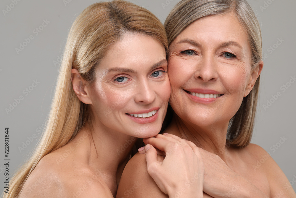 Beautiful women with healthy skin on gray background Beautiful women with healthy skin on gray background