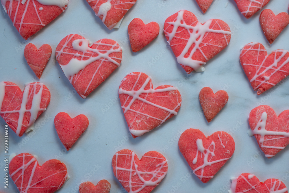 Heart shaped cookies with pink and white icing Heart shaped cookies with pink and white icing
