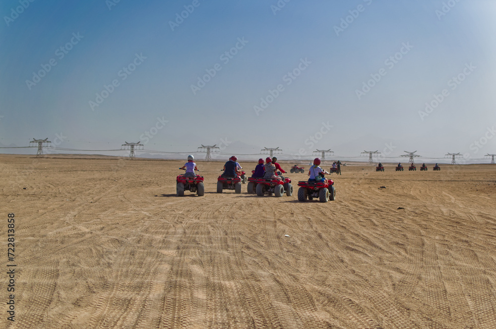 Tourists during quad safari in desert near Hurghada, Egypt.