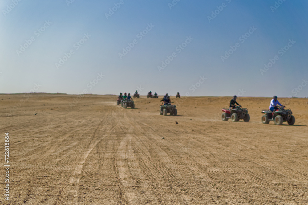 Tourists during quad safari in desert near Hurghada, Egypt.