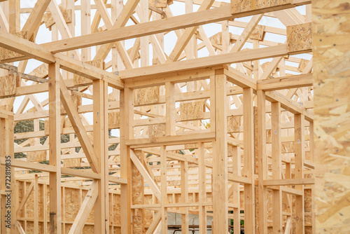 Prefabricated wooden house construction site, wood beam joists and wood chip boards