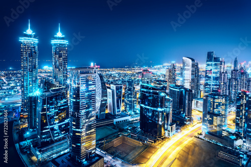 Fantastic view on a big city at night with illuminated modern architecture. Dubai downtown, United Arab Emirates.