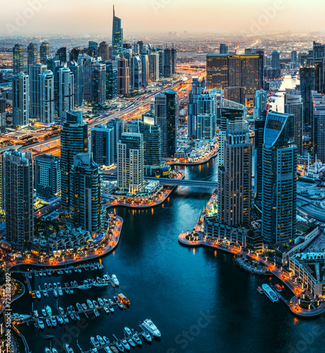 Modern achitecture of a big city. Fantastic rooftop view of Dubai Marina, United Arab Emirates. Nighttime skyline. photo