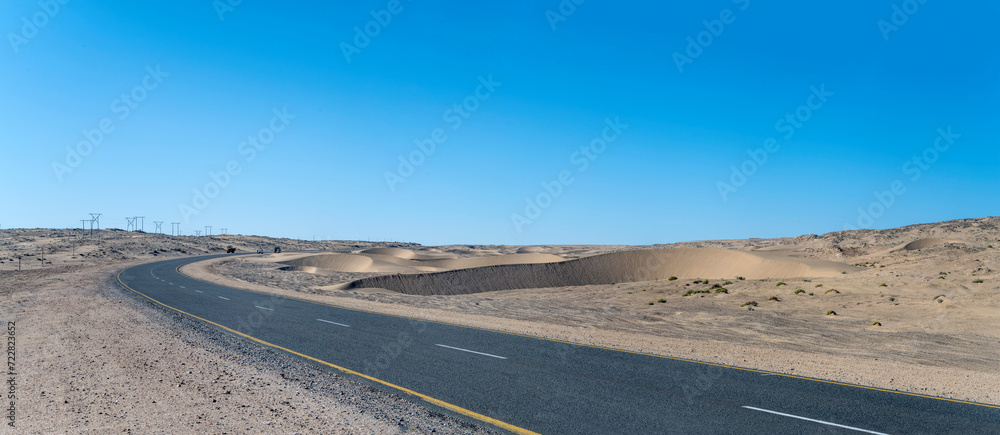 sand dunes and B4 tar road in Sperrgebiet desert, near Luderitz,  Namibia