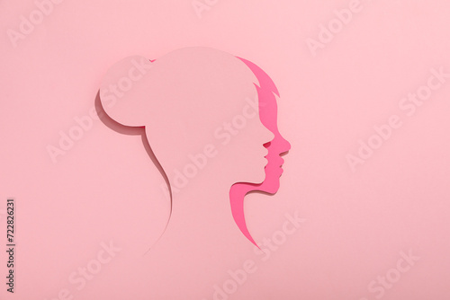 Paper female head on a light background © Atlas