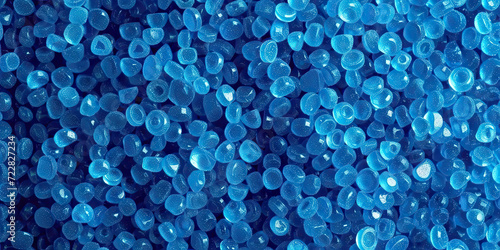  3d blue tiny plastic cylindrical grains , blue plastic polymer pellets,polymer for pipes, Plastic and polymer industry,blue PVC granulate.Microplastic products.