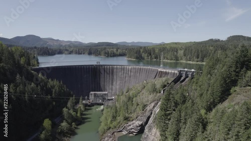 Ungraded 4k trucking aerial drone footage of a hydroelectric dam at Alder Lake in Washington State.