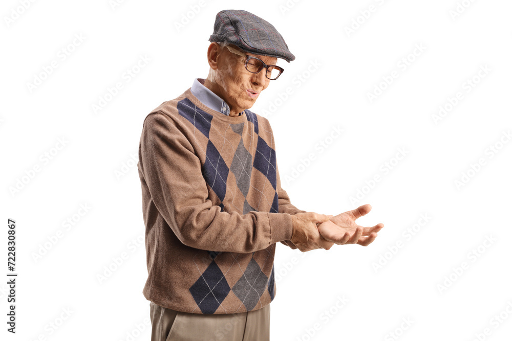 Elderly man measuring heart beat on his wrist Elderly man measuring heart beat on his wrist