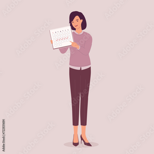 One Smiling Businesswoman Standing And Displaying A Monthly Calendar With Checkmark. Full Length.