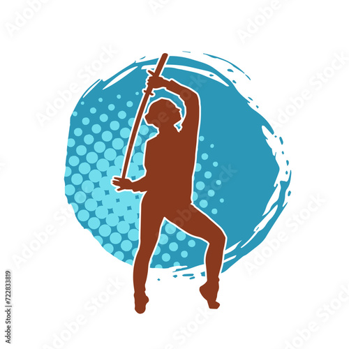 Silhouette of a female fighter in action pose carrying sword weapon.