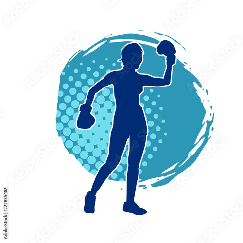 Silhouette of woman boxing athlete in action pose. Silhouette of a female wearing boxing gloves for boxing sport.
