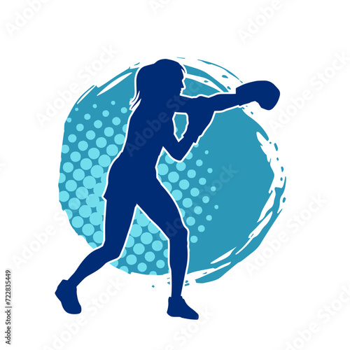 Silhouette of woman boxing athlete in action pose. Silhouette of a female wearing boxing gloves for boxing sport.
