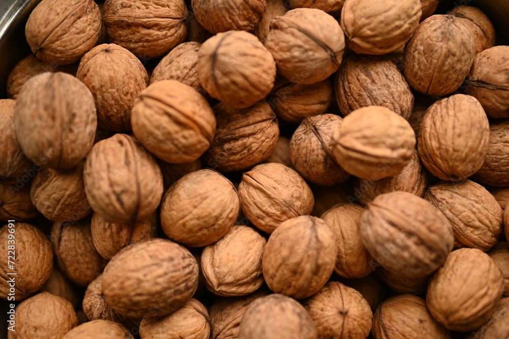 Top view of whole walnuts as background texture Top view of whole walnuts as background texture