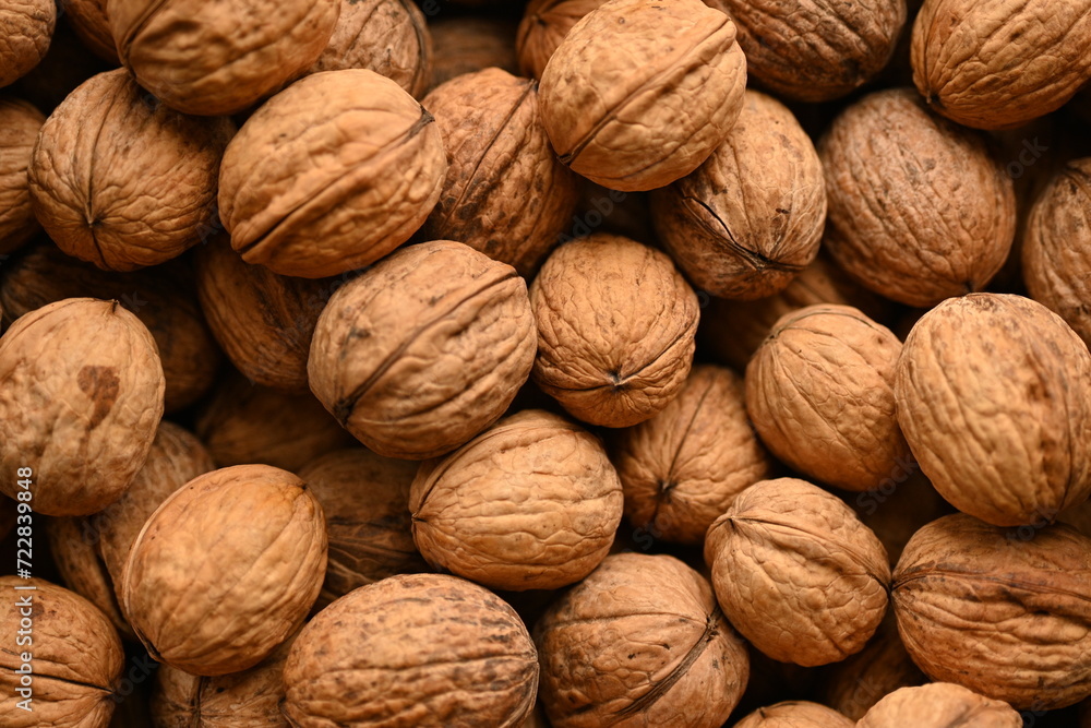 Top view of whole walnuts as background texture Top view of whole walnuts as background texture