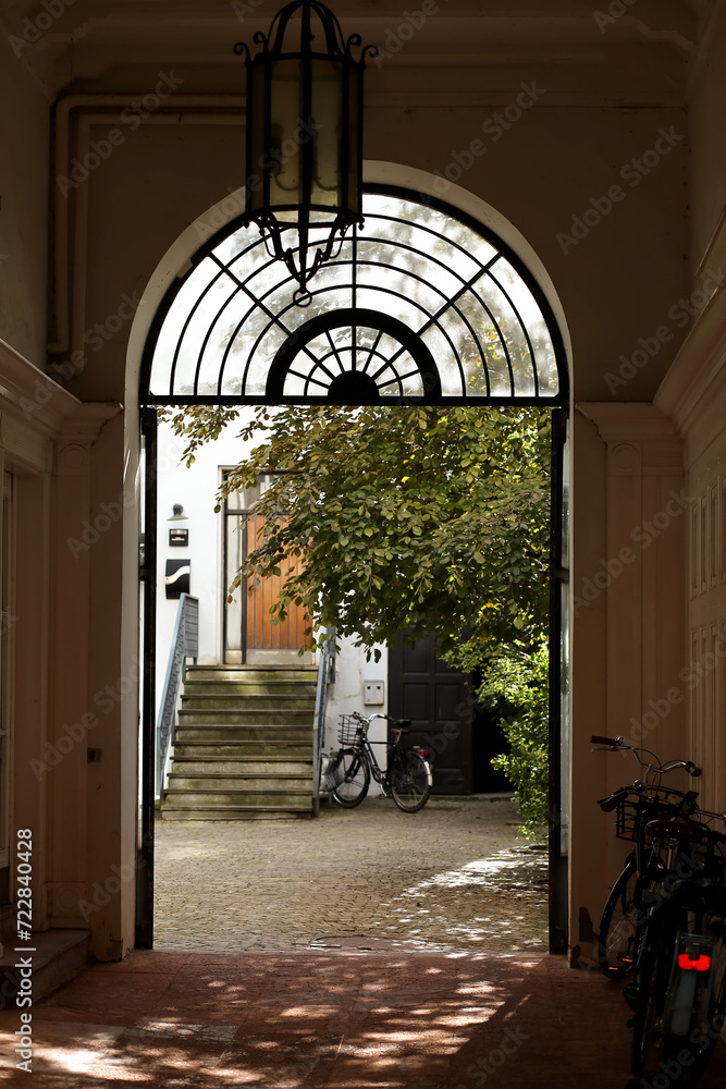 Copenhagen, Denmark - August 17, 2023: cosy courtyard of a house with greenery near Amalienborg palace