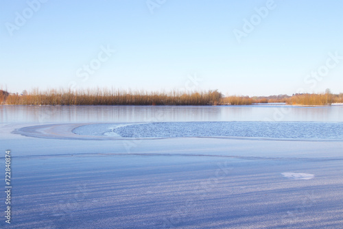 Ice and open water on the lake before it all will be frosen