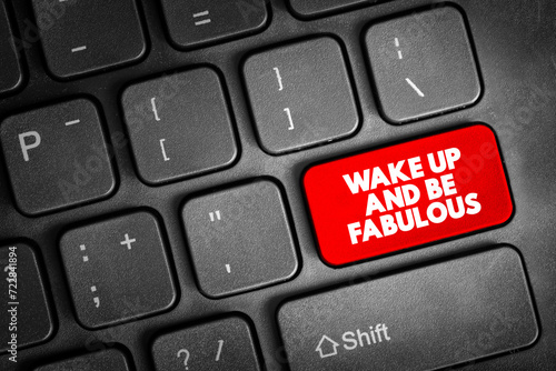 Wake up and be fabulous text button on keyboard, concept background photo