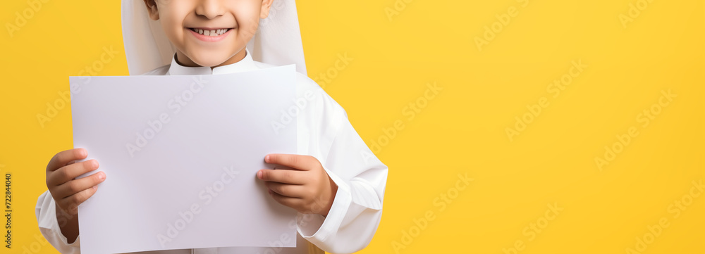 muslim kids holding blank empty paper presenting something in copy space muslim kids holding blank empty paper presenting something in copy space