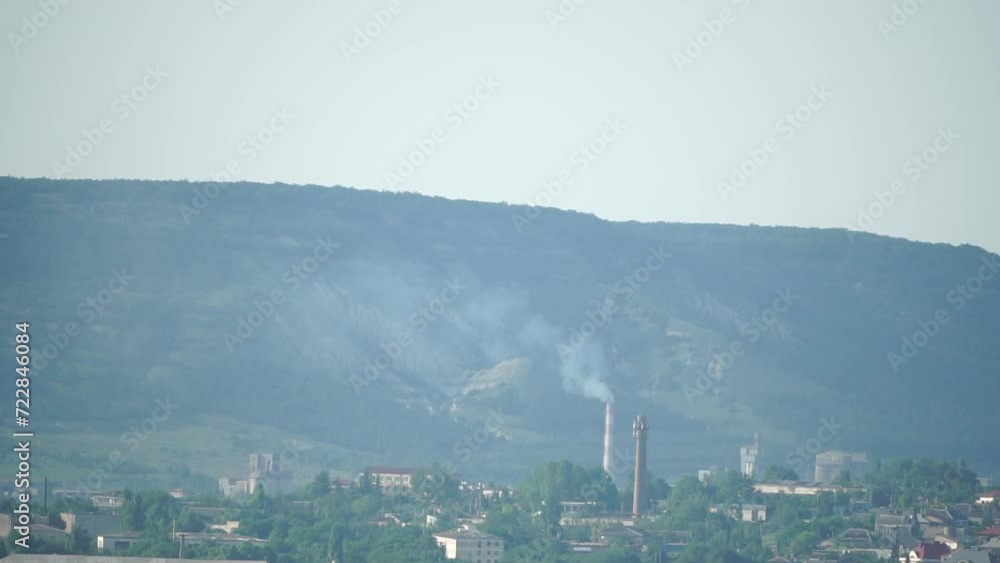 Industrial facility: cement plant with smoking chimney, emission observed Industrial facility: cement plant with smoking chimney, emission observed