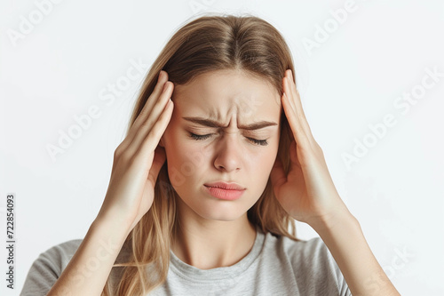 Headache Struggle: Young Woman Expressing Discomfort and Pain, Holding Her Temples with a Painted Expression, Against a Calm Light Background