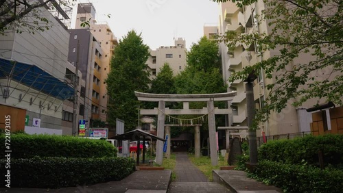 Tokyo Neighborhood in Suburban Area, Stone Torii Gate between Apartments photo