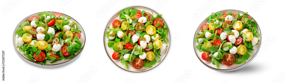 Caprese Salad with Cherry Tomatoes and Pesto Sauce on White Background Caprese Salad with Cherry Tomatoes and Pesto Sauce on White Background