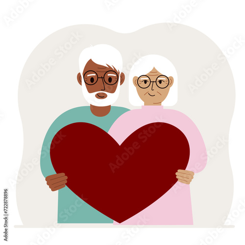 Happy man and woman holding a big red heart in their hands. Love
