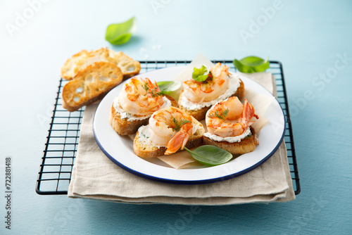 Shrimp crostini with cream cheese and herbs