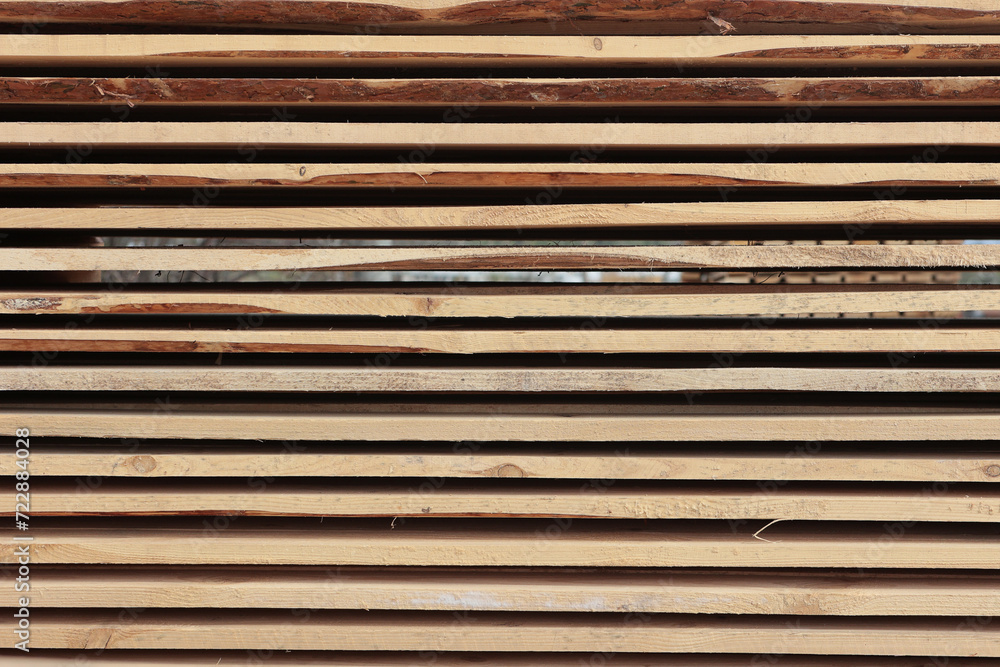 Wooden planks. Side view. Production of wooden pallets. The texture of wooden boards. Wooden planks. Side view. Production of wooden pallets. The texture of wooden boards.