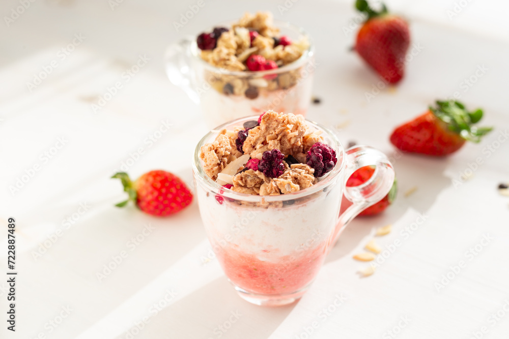 Yogurt with red fruit granola with strawberry cream, almonds and chocolate chips. Healthy snack idea for children. Yogurt with red fruit granola with strawberry cream, almonds and chocolate chips. Healthy snack idea for children.