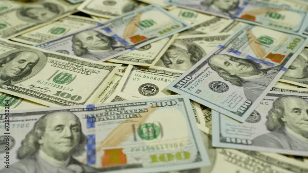 Close-up of hundred dollar bills lying on the banker's desk. Currency exchange of finance and working with American currency in cash. High quality 4k footage Close-up of hundred dollar bills lying on the banker's desk. Currency exchange of finance and working with American currency in cash. High quality 4k footage