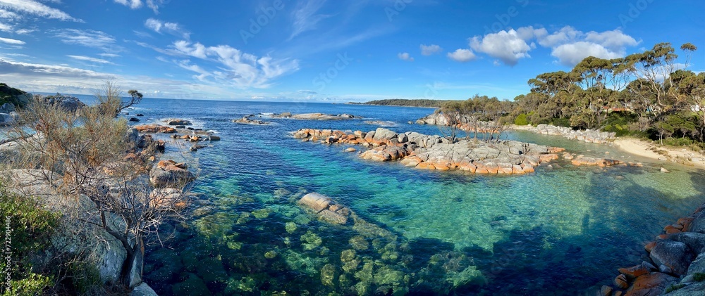 view of clear waters on rocky coastline of tasmania