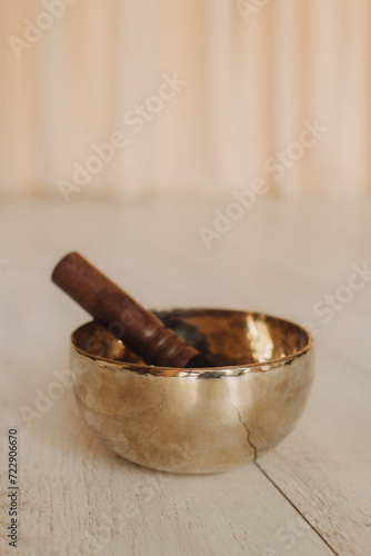Close up photo of Tibetan singing bowl. Vintage tonned. Soft focus, blurred and noise effect