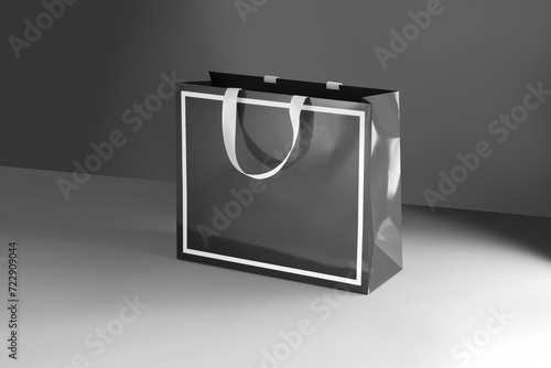 Black paper glossy shopping bag mockup with white handles