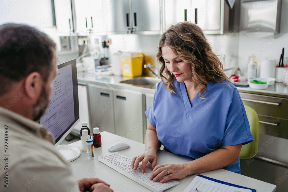 Doctor consulting with overweight patient, discussing test result and x-ray scans in doctor office. Concept of health risks of overwight and obesity. Doctor consulting with overweight patient, discussing test result and x-ray scans in doctor office. Concept of health risks of overwight and obesity.