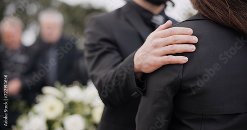 Funeral, support and people care for grief, mourning or depressed mother at burial ceremony, memorial service or cemetery. Hand, shoulder and man helping sad woman with love, advice or family comfort photo