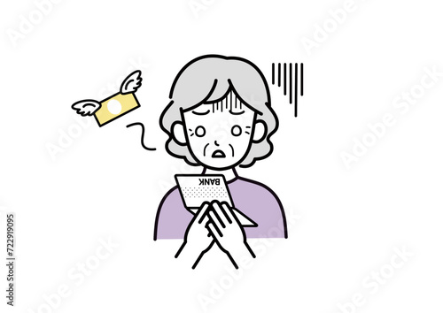 通帳を見て落ち込むシニア女性