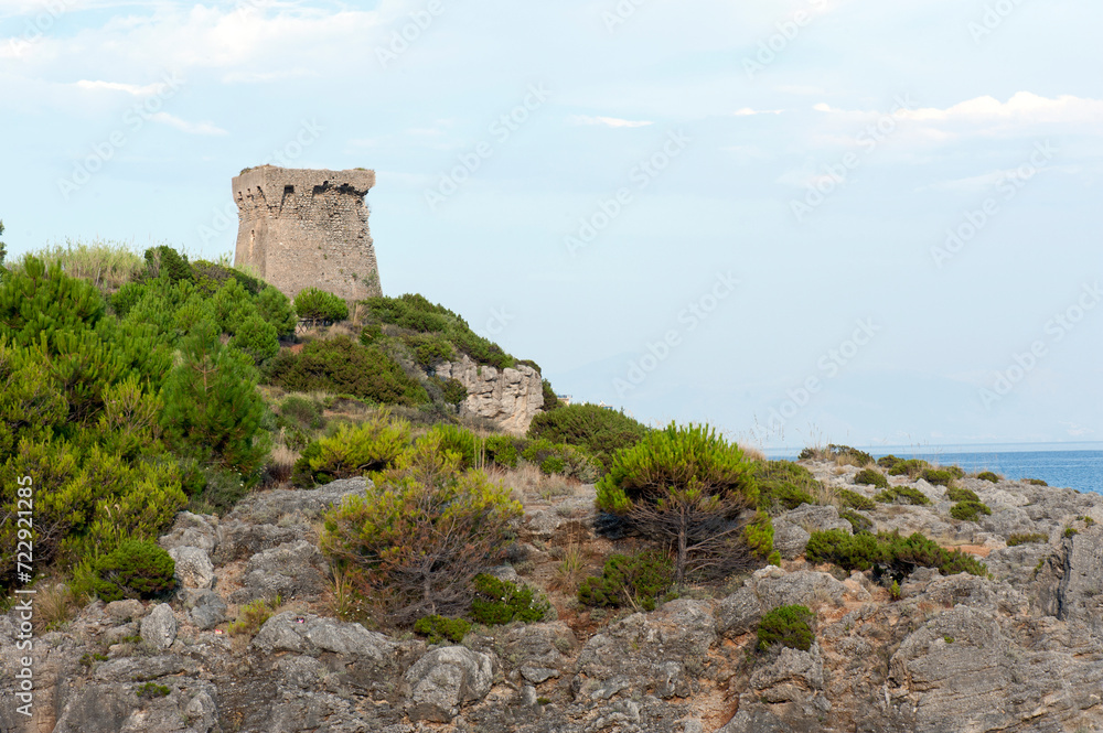 Ancient ruined watchtower (mid-1500s ) on the cliff along the coast to prevent Saracen and pirates incursions. Marina di Camerota, Italy. Ancient ruined watchtower (mid-1500s ) on the cliff along the coast to prevent Saracen and pirates incursions. Marina di Camerota, Italy.