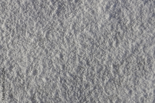Snow background wihs grey textures for snowy winter wallpaper or pattern.