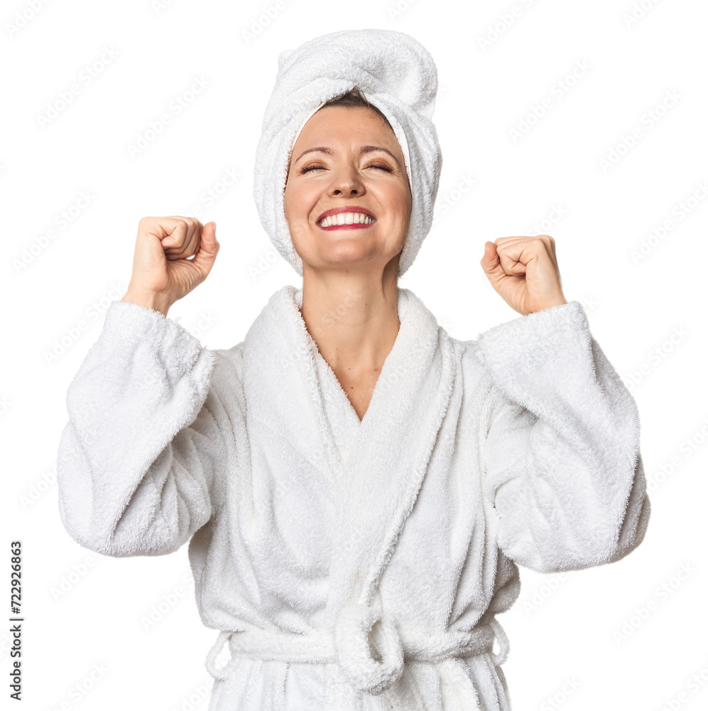 Caucasian woman in bathrobe and towel celebrating a victory, passion and enthusiasm, happy expression. Caucasian woman in bathrobe and towel celebrating a victory, passion and enthusiasm, happy expression.