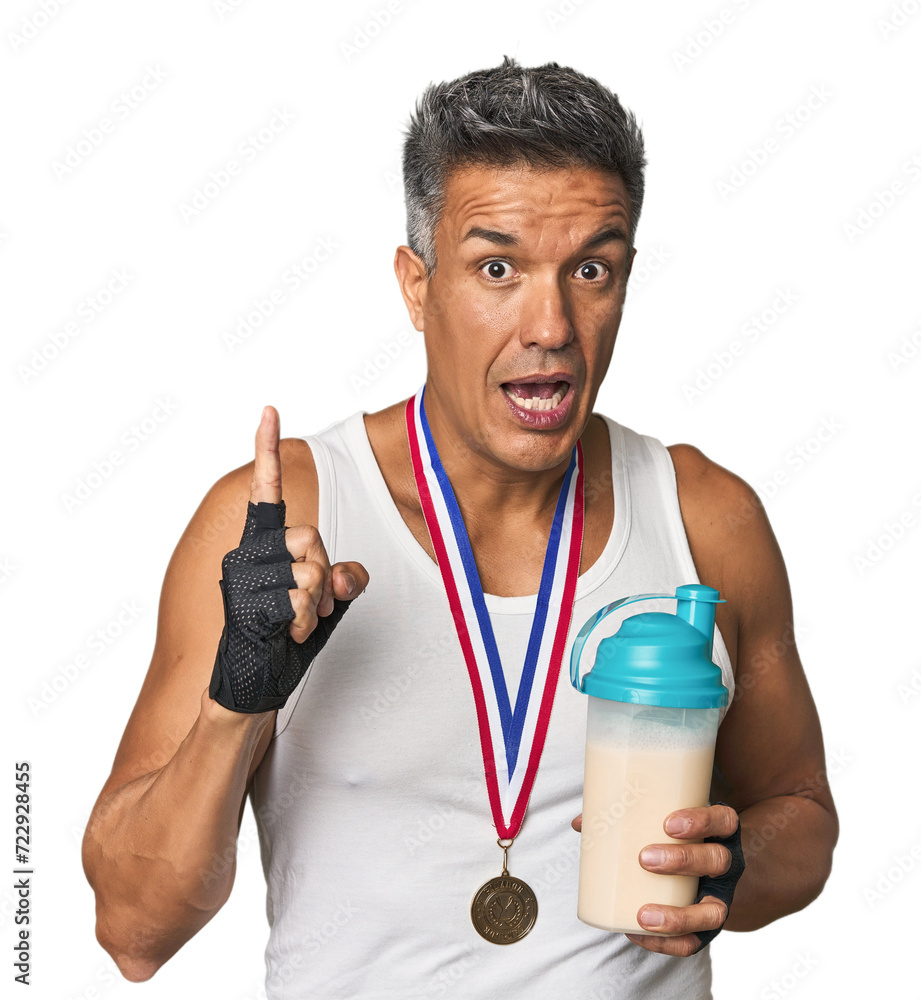 Athletic Hispanic with protein and gold medal having an idea, inspiration concept. Athletic Hispanic with protein and gold medal having an idea, inspiration concept.