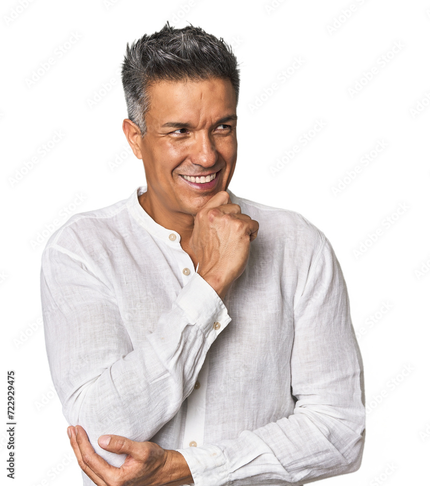 Middle-aged Latino man relaxed thinking about something looking at a copy space. Middle-aged Latino man relaxed thinking about something looking at a copy space.
